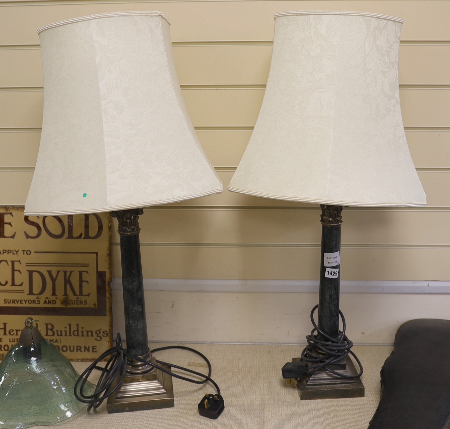 A pair of tall electroplate mounted serpentine Corinthian column table lamps, 83 cm high including shades